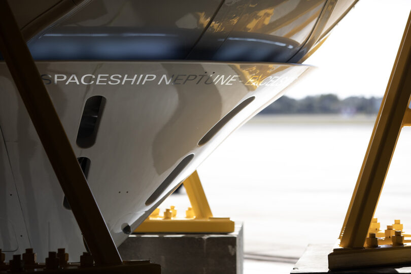 A white space capsule corner with the word "Spaceship Neptune" in the middle of it, offering the world’s first luxury spaceflight service.