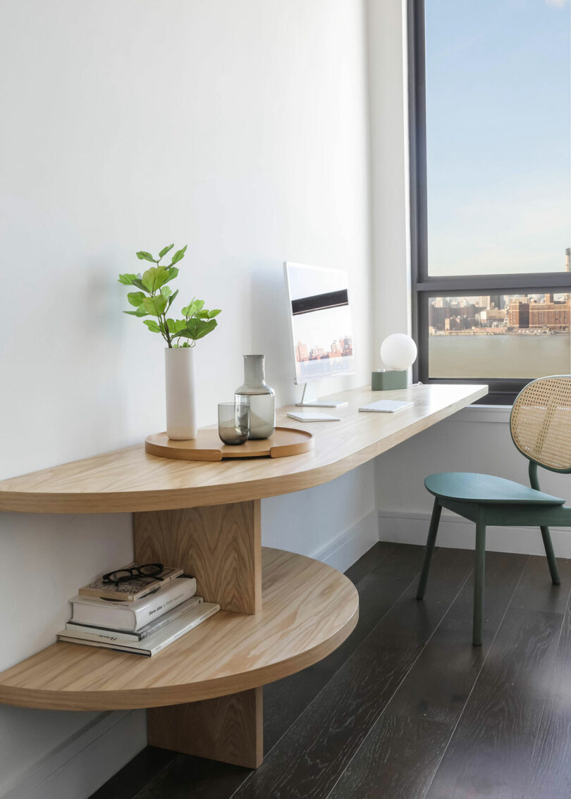 Built-in, curvilinear desk with chair.