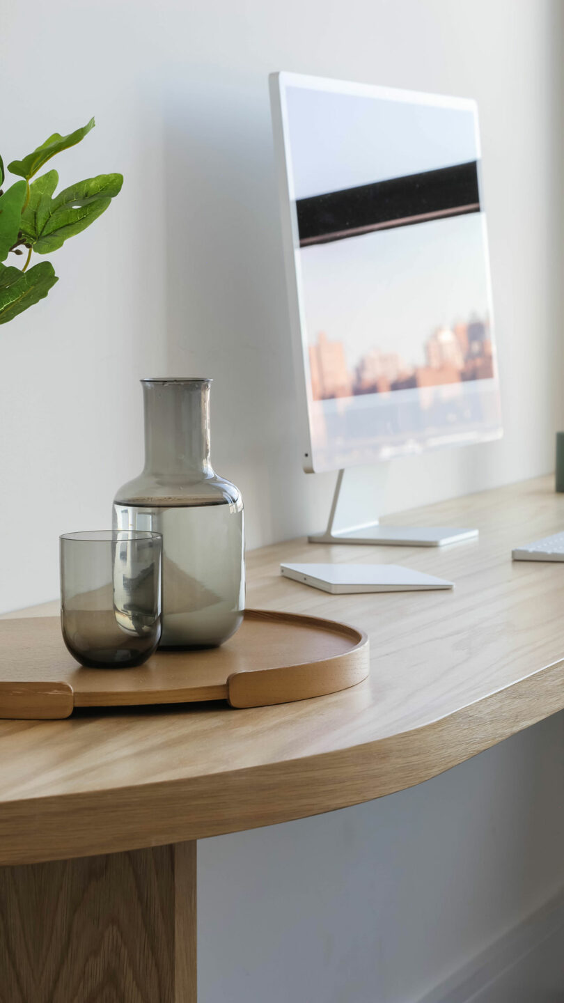 Tabletop of built-in, curvilinear desk.