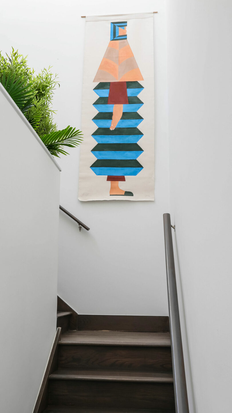 Ascending stairwell with textile art.