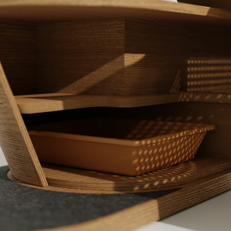 A wooden shelf with a tray in it, designed as cat furniture.