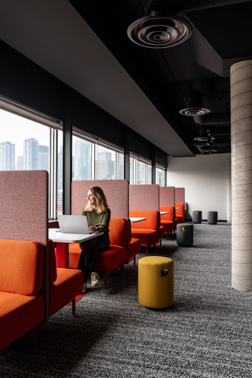 woman sitting next to a window