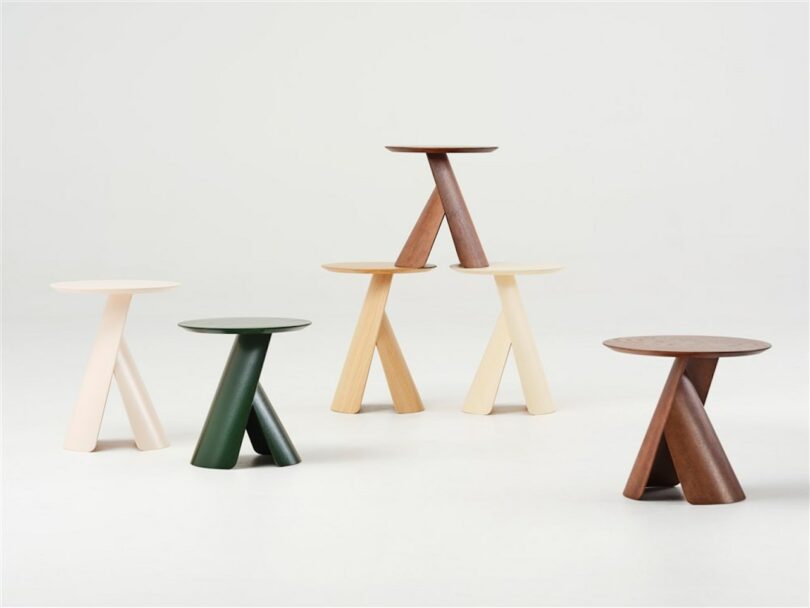 six round wooden coffee tables in grey