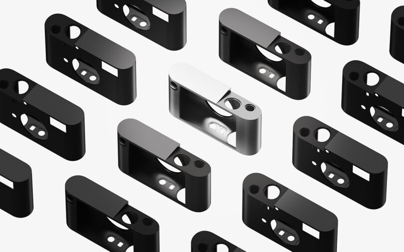 A black and white image of a group of black and white Leica M Reimagined Concept camera aluminum unibodies.