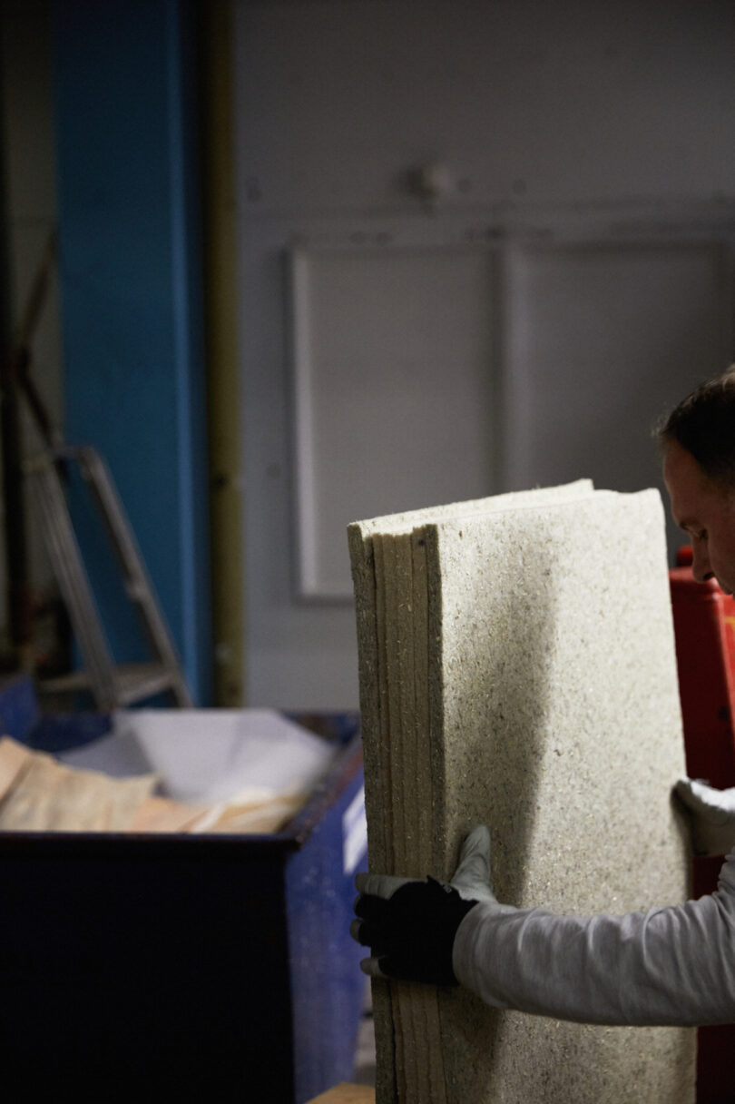 hands holding material sheets