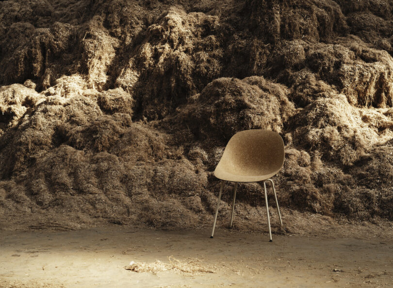 chair in front of a large pile of hemp fibers